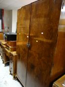 A vintage polished bedroom suite comprising double wardrobe, dressing table & a pair of bedside