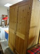 A two-door pine wardrobe