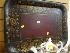 An antique floral painted tin tea tray
