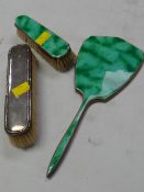 A silver & enamel back looking mirror & matching brush together with a silver back brush