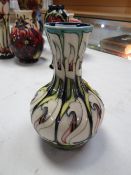 A Moorcroft narrow neck vase in the Two-Star Member pattern, no. 144 by Emma Bossuns, dated 2007