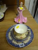 A Royal Worcester four-piece cabinet teaset together with a Coalport figure 'Especially for You'
