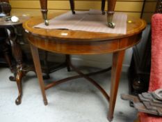 An Edwardian inlaid mahogany circular table
