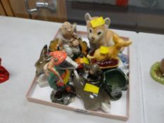 A parcel of small figurines including Beswick Hiker Badger, Wade novelty figures, other Beswick etc