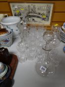 Two decanters, various cut glass drinking glasses, glass candlesticks etc
