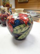 A Moorcroft baluster vase with narrow neck in the Symian pattern, dated 1999 by Phillip Gibson