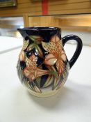 A Moorcroft jug in the Peruvian lily pattern, dated 2003