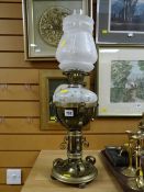 A brass aesthetic-style oil lamp with mottle glass reservoir & etched glass shade