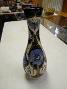 A Moorcroft floral narrow neck vase, the study in blue pattern, no.165/250, 16inches high by