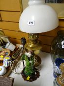 A ceramic Chinese mandarin table lamp together with brass oil lamp