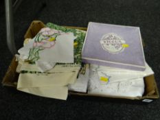 A box of vintage table linen etc