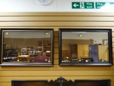 A near pair of modern mirrors