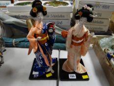A pair of Oriental Geisha dolls