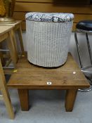 A square topped table & a half-moon Lloyd Loom Lusty linen basket