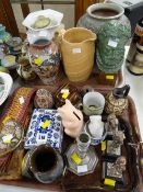 A parcel of ethnic items & tourist pottery, three metallic soldier figures & a parcel of pottery &
