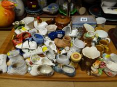 A quantity of pottery novelty shoes etc