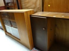 A sliding door bookcase, an open bookcase with cupboard & a two-door glazed bookcase