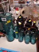 A dimpled green glass lemonade set & a mottled pottery teaset