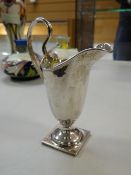 A Birmingham silver Georgian period helmet cream jug