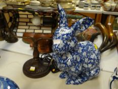 A Tiffany-style adjustable reading lamp and a pottery blue & white rabbit