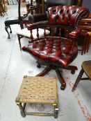 A reproduction buttoned leather captain-style swivel office chair together with a rush topped stool