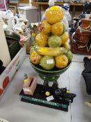 A reproduction 'Cat & Mouse' money box & a novelty pottery fruit bowl