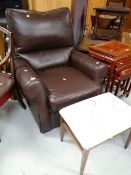 A modern brown leather armchair & non matching stool