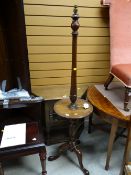 A tripod mahogany standard lamp with table / shelf
