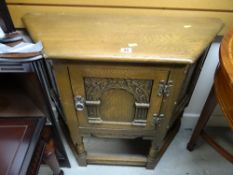 A Priory-style hall table with cupboard door
