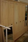 Set of three ultra modern light wood wardrobes and a near matching wall mirror