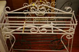 Two wrought iron plant stands and a similar magazine rack