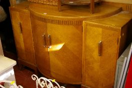 Good oak Art Deco dining suite of bow front sideboard, draw leaf dining table and six chairs (two