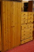Modern pine four piece bedroom suite of two door wardrobe, two short over four long chest of drawers