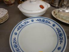 Blue and white dish and a tureen cover, both having the emblem for The People's Republic of China