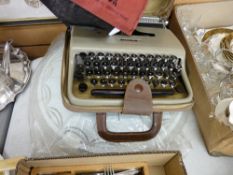 Cased Olivetti typewriter and a retro ceiling lamp