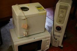 Daewoo breadmaker, Delonghi heater and a white coloured microwave oven E/T