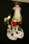 Spode bone china figurine of a huntsman with his dog titled 'Chelsea Figures No. 3'