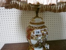 Oriental decorated table lamp with shade
