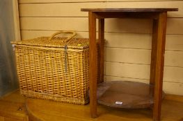 Wicker picnic basket and a two tier oak circular table