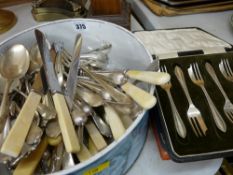 Tin of mixed cutlery and cases of cutlery