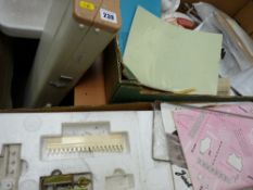 One cased knitting machine, a boxed knitting machine and a box of accessories