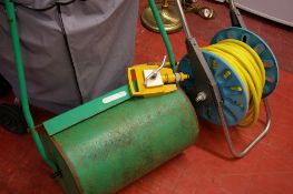 Garden hose reel and a metal garden roller
