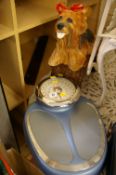 Stylish set of bathroom scales, small stool and a dog garden ornament