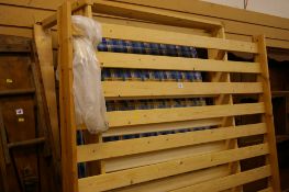 Modern pine single bed frame and mattress with a modern pine double bed frame