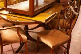 Extending twin pedestal dining table and six (four plus two) reproduction Hepplewhite style dining