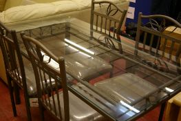 Stylish glass topped metal dining table and four chairs