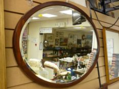 Oval mahogany framed bevelled wall mirror