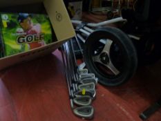 Quantity of Titleist golfing irons, a Trimaster three wheel golf trolley and a quantity of golfing