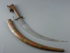 A DECORATIVE MOROCCAN SMALL CURVED SWORD with white metal inlay decoration and brass bandings to the