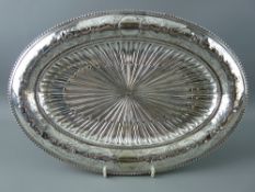 A FINE OVAL CLASSICAL STYLE BRIGHT CUT ELECTROPLATED SERVING DISH on a low pedestal having a